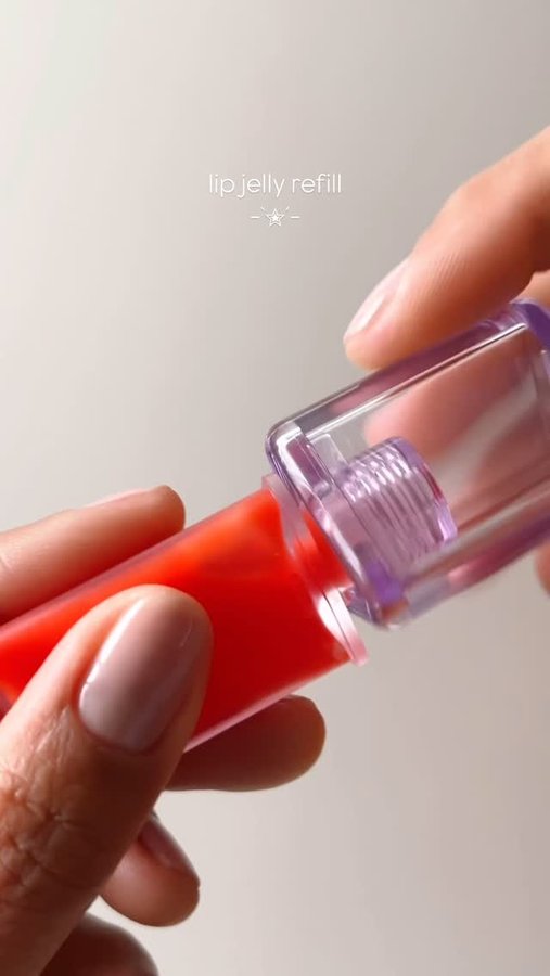 Instagram post by @overglowedit for KraveBeauty. Caption reads: Swapping out my @kravebeauty lip jelly refill so I....