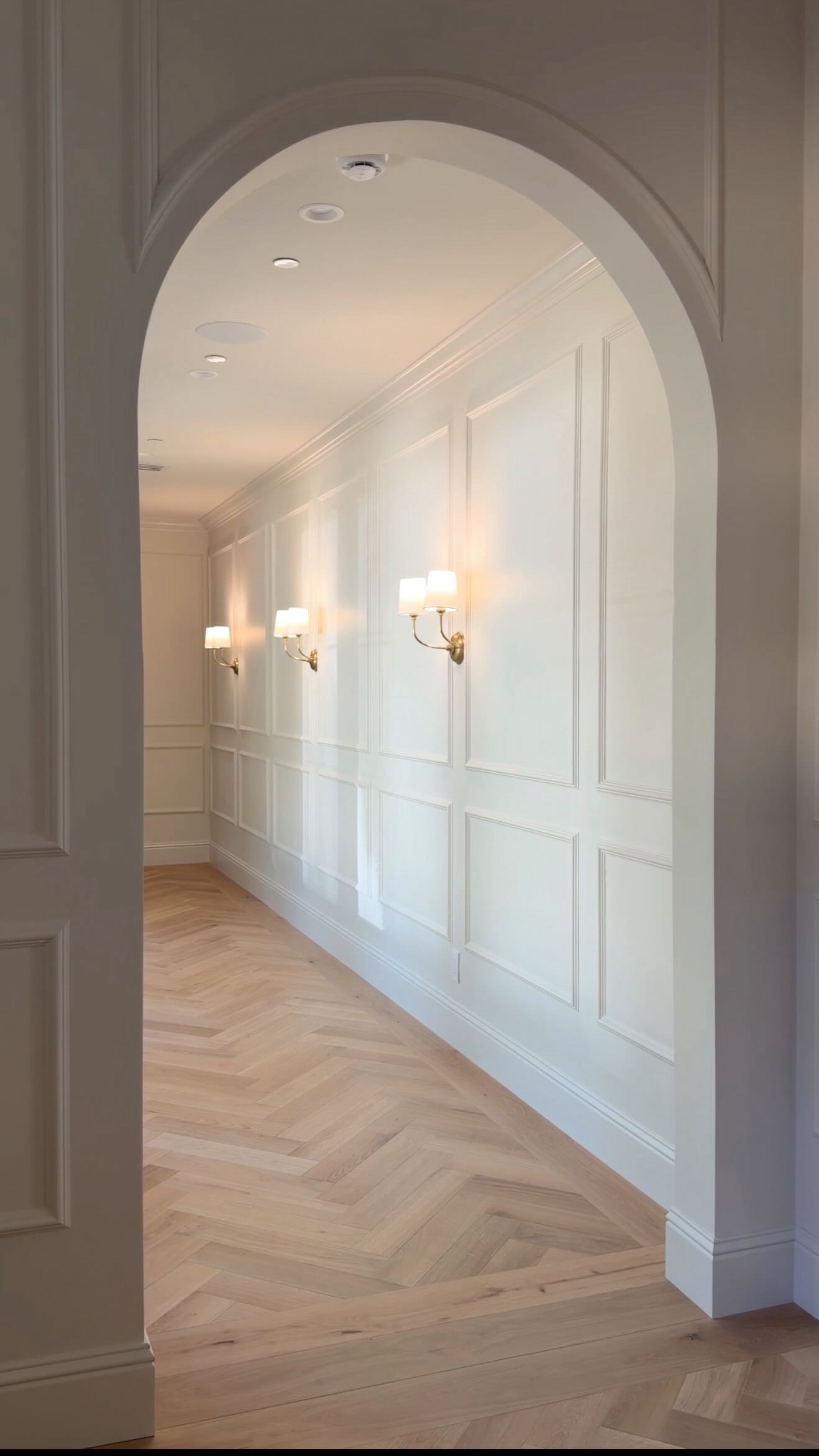 Instagram post by @aurelie.erikson for Benjamin Moore. Caption reads: The hallway of my ACTUAL dreams ☁️… from the trim....