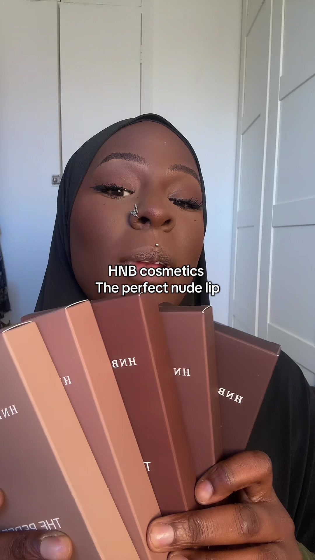TikTok post by @ameenaroshae for HNB Cosmetics. Caption reads: trying out the new @HNB Cosmetics perfect nude kip....