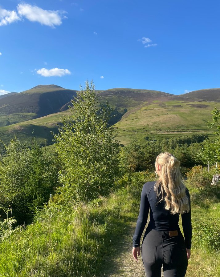 Instagram post by @lifeinthelakedistrict_ for ACAI Outdoorwear. Caption reads: Manifesting this sunshine! ☀️ So ready for those....