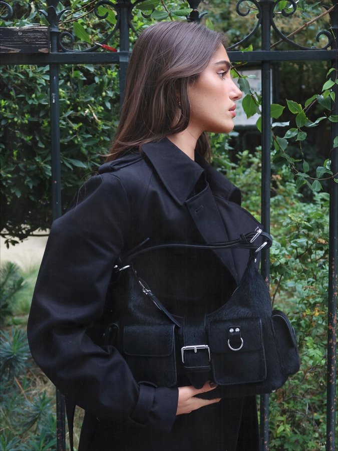 Instagram post by @leach_v for The Kooples. Caption reads: bag + trench = @thekooples 🖤

collaboration....