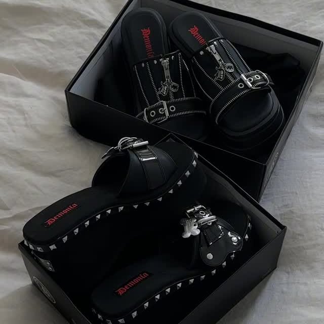Instagram post by @megmurayama for Demonia Shoes. Caption reads: ordered 2 pairs of @demonia.shoes platform sandals....