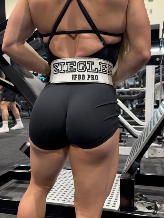 Instagram post by @zoeroseziegler for BOMBSHELL SPORTSWEAR. Caption reads: Another day. Another heavy leg day with gangster....