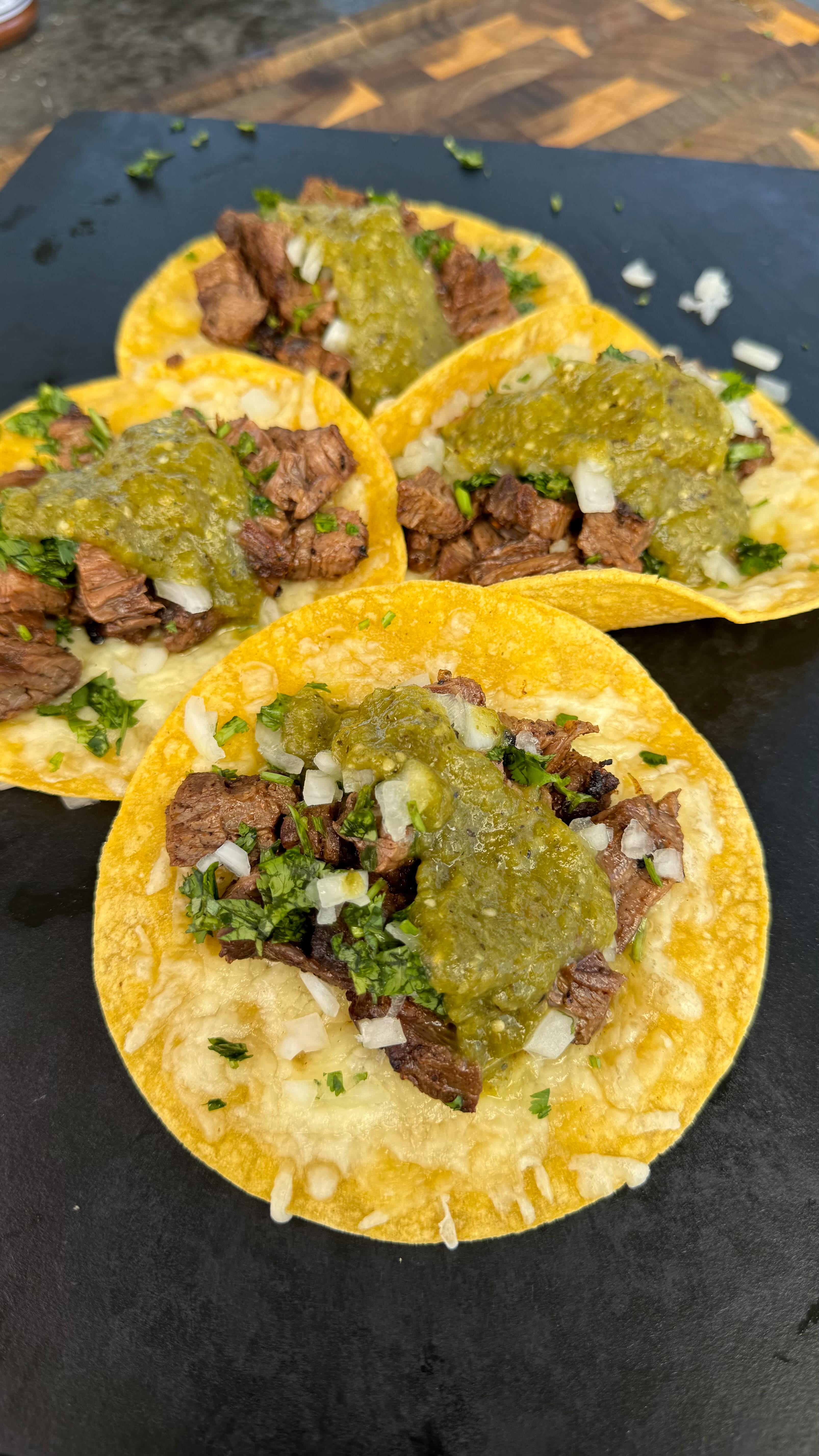 Instagram post by @cooking_with_fire___ for Dawn. Caption reads: Skirt steak tacos with green salsa? #Dawn_Partner....