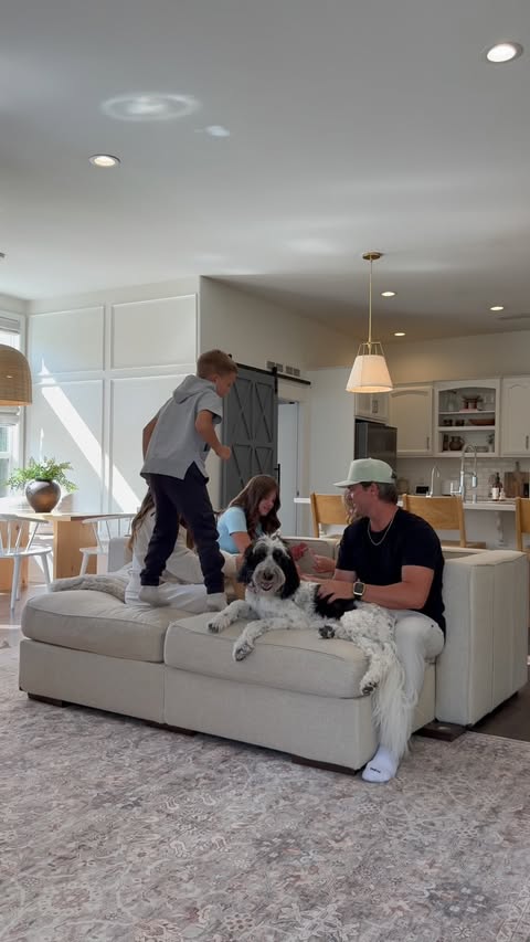 Instagram post by @britt_horton for Lovesac. Caption reads: [...] agenda: couchmaxxing with the fam Our....