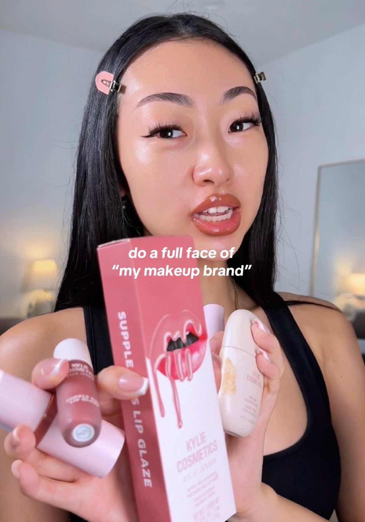 TikTok post by @itsbabykelz for Kylie Cosmetics. Caption reads: [...] guess my makeup brand is @Kylie Cosmetics....