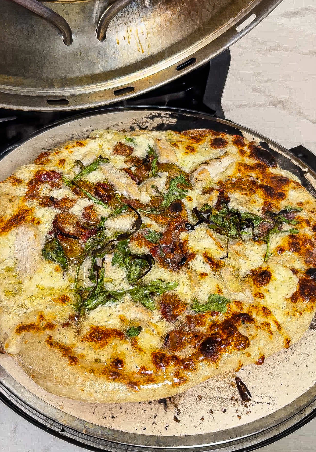 TikTok post by @shoppingwithpassionj for GraniteStone. Caption reads: The @Granitestone Piezano 🍕 is saving my family a....