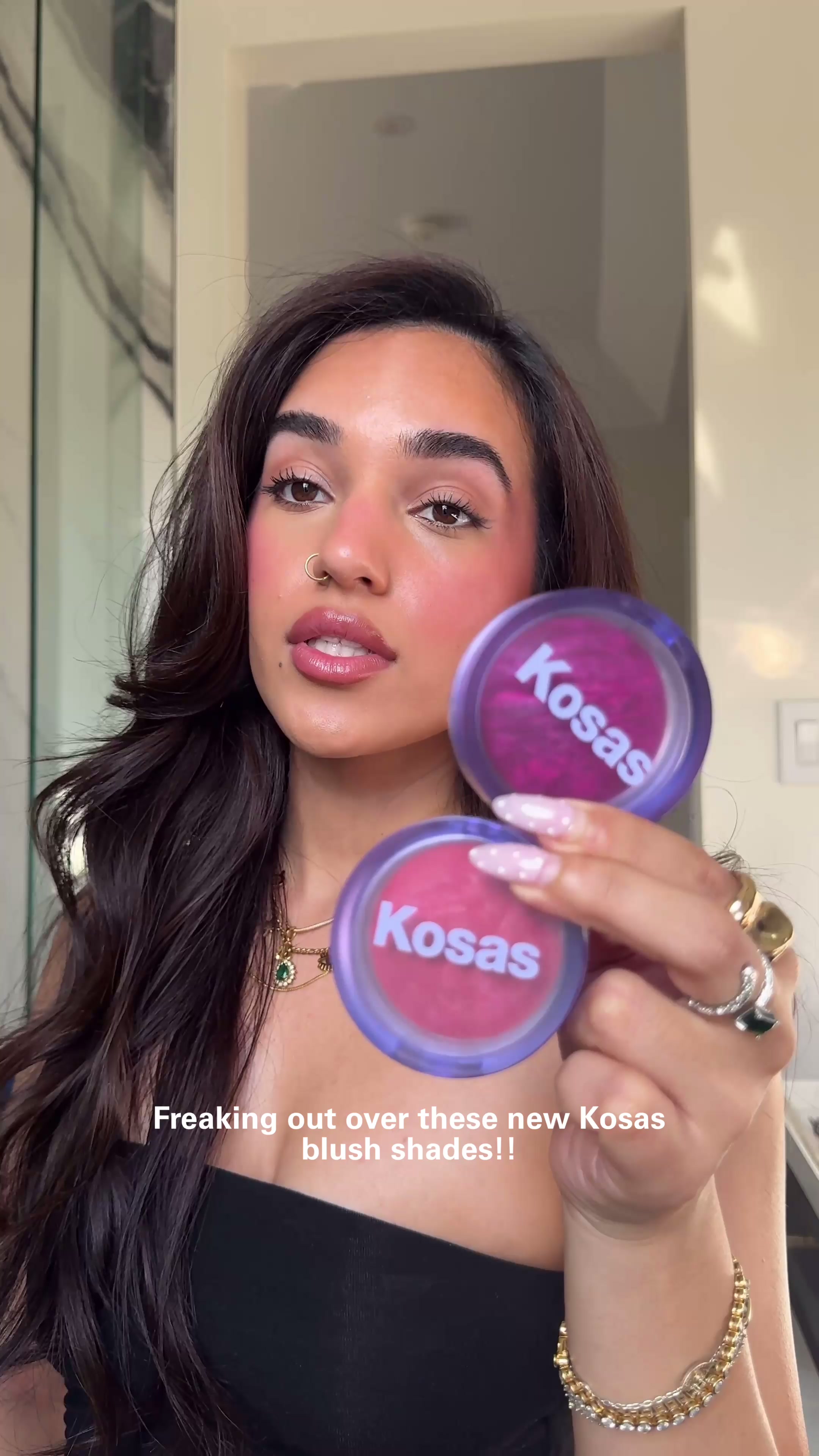 TikTok post by @anjana.dhimann for Kosas. Caption reads: [...] not slather my face with these brand new....