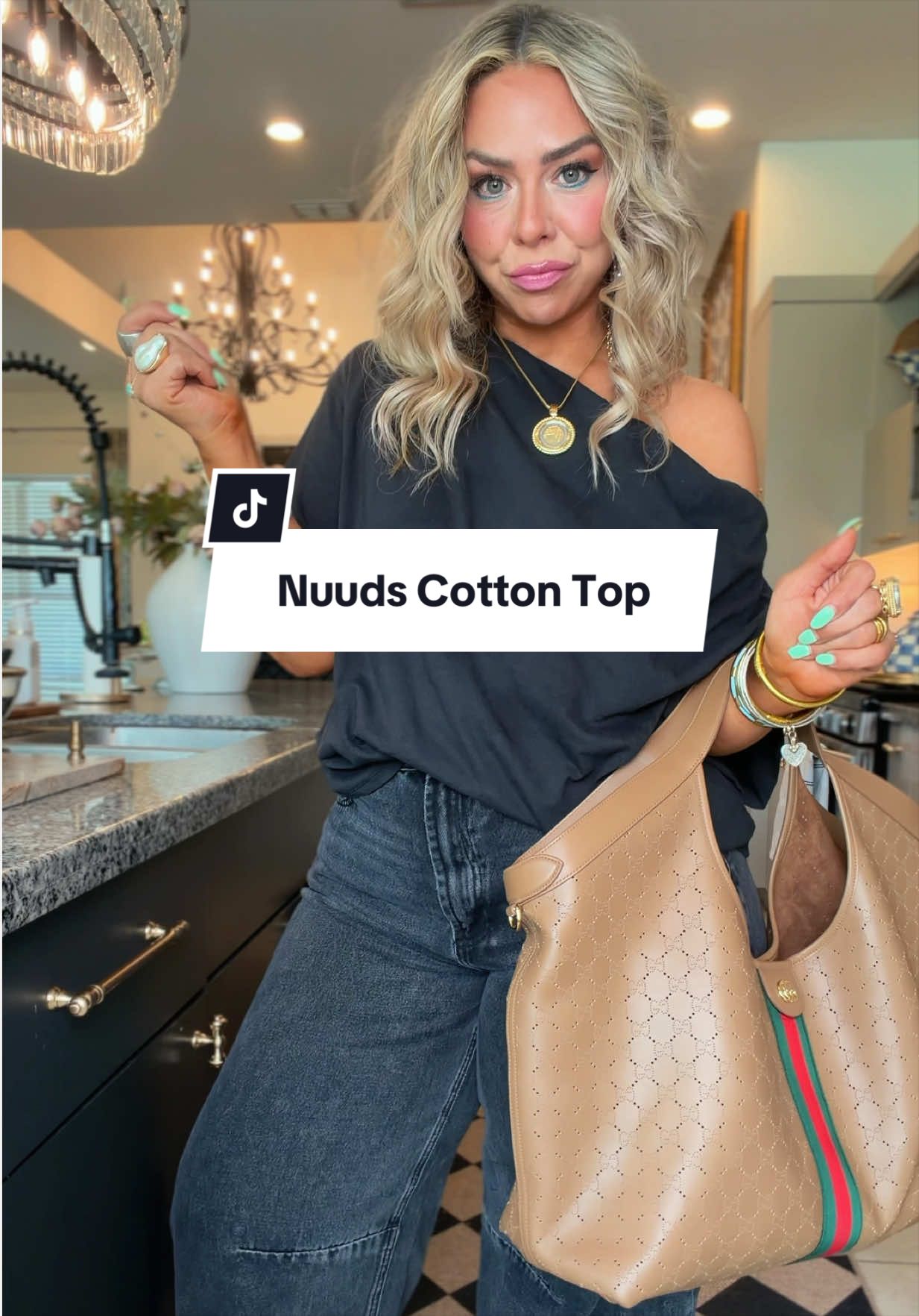 TikTok post by @lindaannettem for nuuds. Caption reads: [...] this off shoulder top is perfection @nuuds....