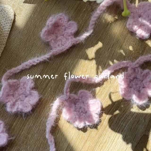 Instagram post by @stitchberryblog for Universal Yarn. Caption reads: The prettiest garland for....