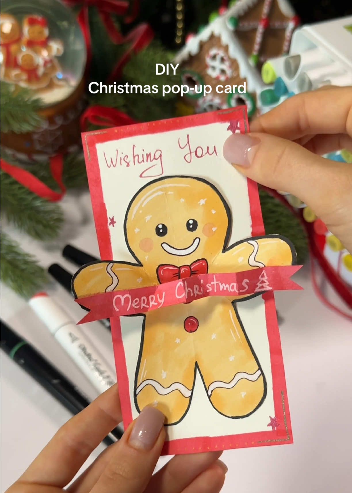 TikTok post by @sandauraaa for Ohuhu. Caption reads: Making a Christmas pop-up card with Ohuhu....