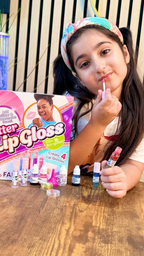 Instagram post by @khadija_world_19 for Vivid Toy Group. Caption reads: AD💋😍✨Fablab Glitter Lip Gloss Studio from....