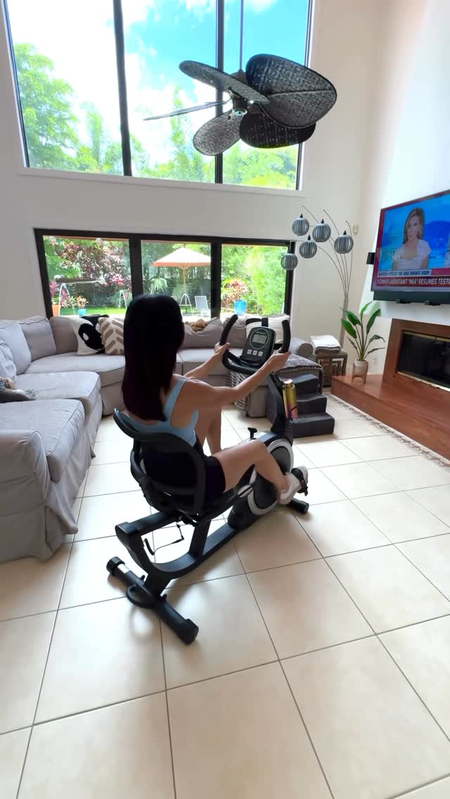 Instagram post by @janine_delaney for Merach. Caption reads: My @merachfit S19 recumbent bike is an effortless....