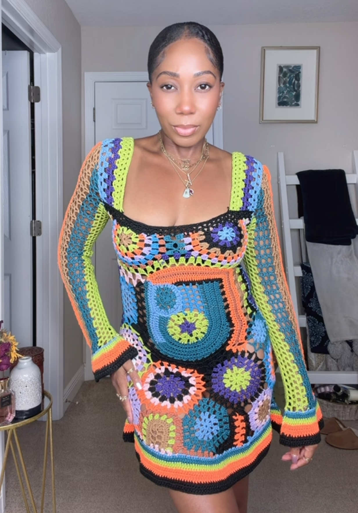 TikTok post by an influencer for AKIRA. Caption reads: [...] Found Knit Mini Dress 🦋💐 @AKIRA #akira....