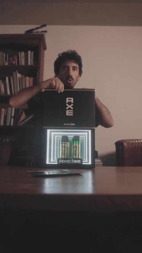 Instagram post by @juanchiroisman for AXE en Español. Caption reads: @axe.espanol #OleDeLujo #FIFA.