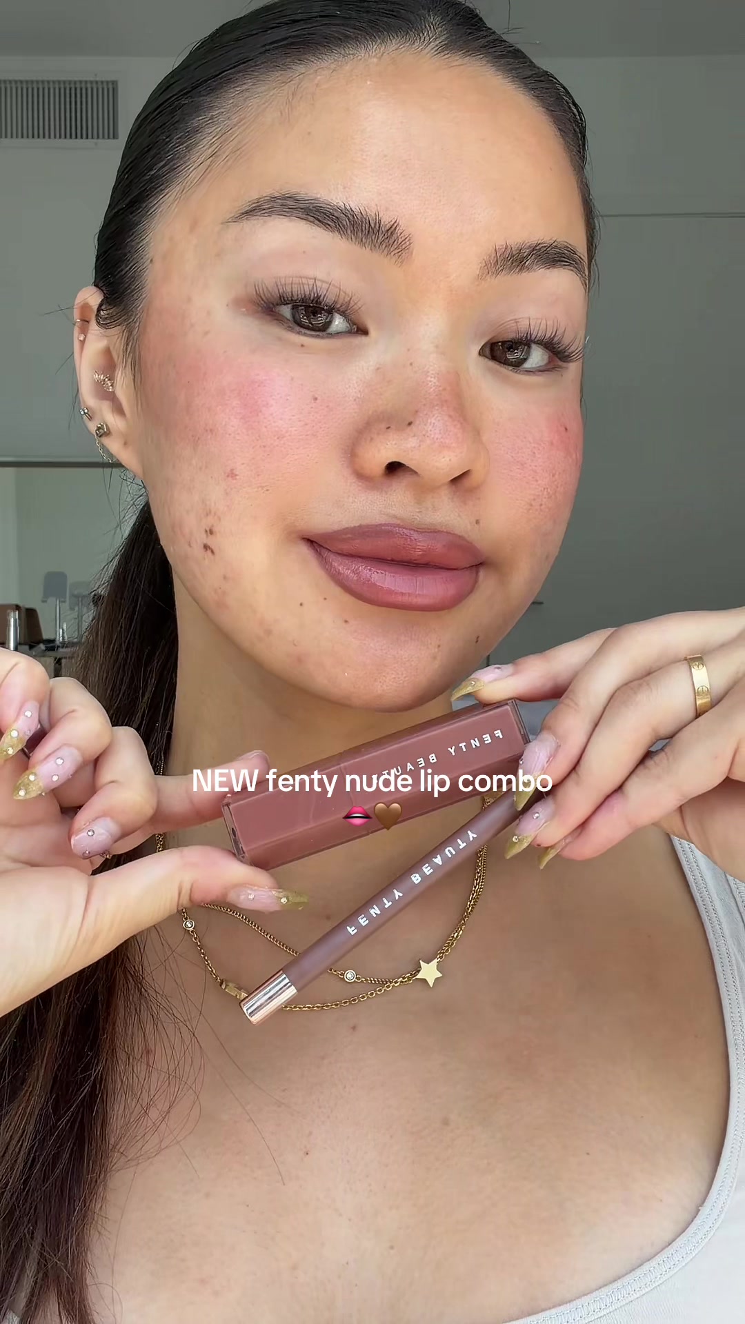 TikTok post by @damnitjanett for Fenty Beauty. Caption reads: [...] glossy lip shades!!🤎 on sale now @Fenty....