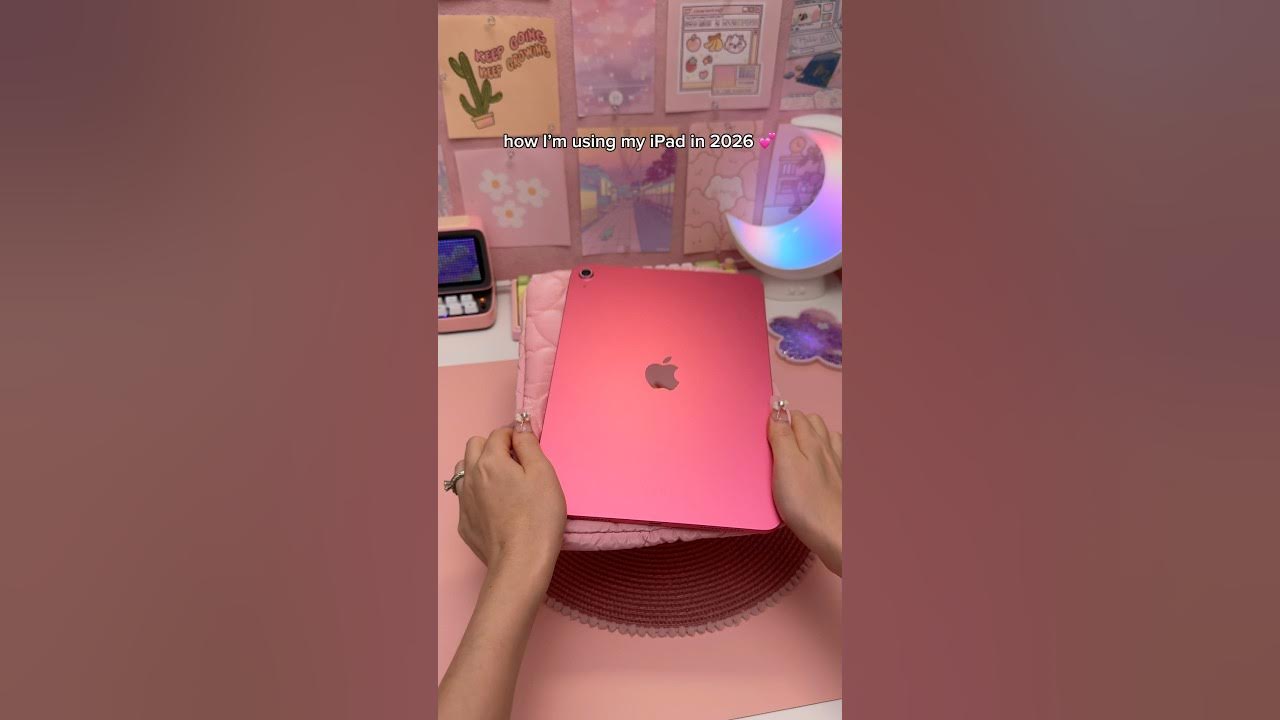 YouTube post by @HappyDownloads for Paperlike. Caption reads: How I'm using my iPad in 2026 💕 | productivity |....