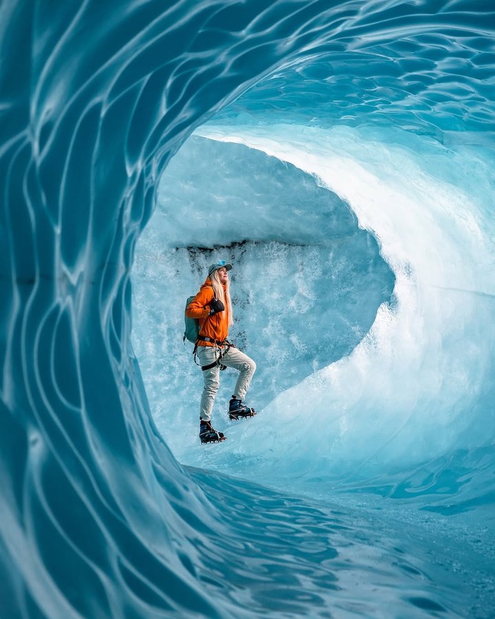 Instagram post by @asasteinars for 66°North. Caption reads: A blue world, soon we will be back 🩵 Ice cave....