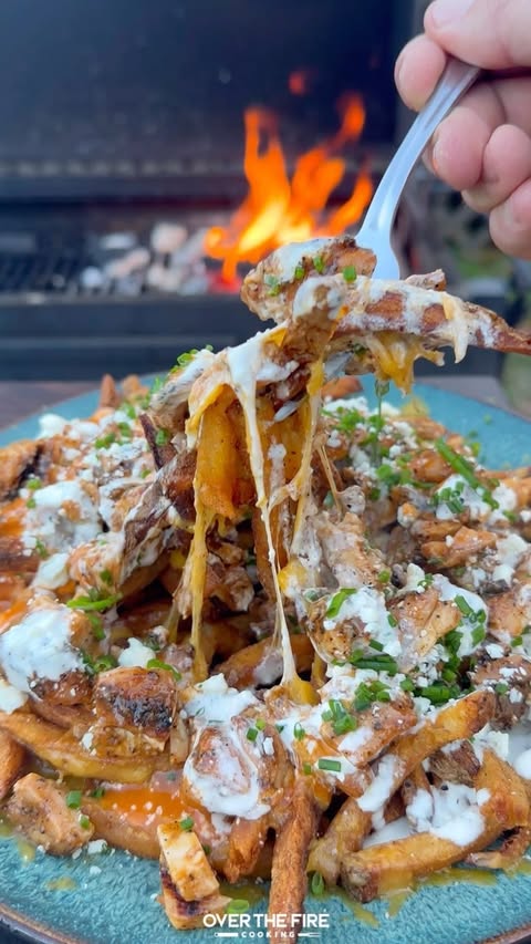 Instagram post by @overthefirecooking for Oklahoma Joe's. Caption reads: Grilled Buffalo Chicken Fries with @oklahomajoes....