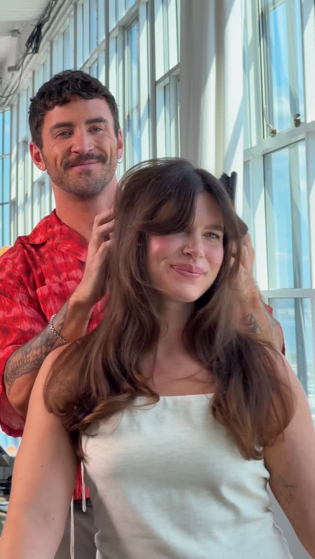 Instagram post by @gardneredmunds for Oribe. Caption reads: Bangs with body and bounce? Consider us....