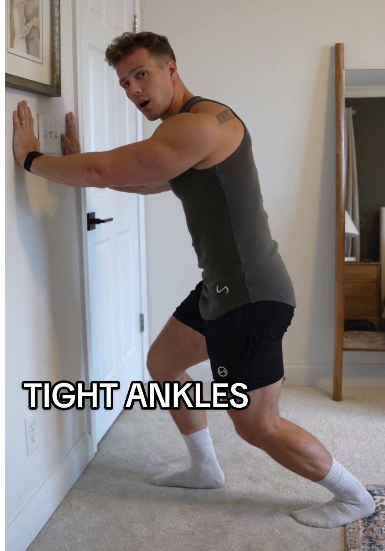 TikTok post by @michaeldean2.0 for TLF Apparel. Caption reads: Can’t squat? Check your ankles @TLFapparel shorts....