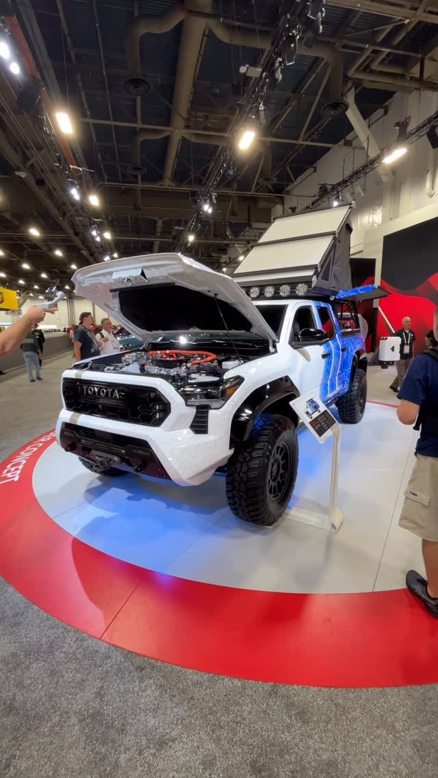 Instagram post by @carbuzz for Toyota USA. Caption reads: Toyota brought an overlanding Tacoma to SEMA with....
