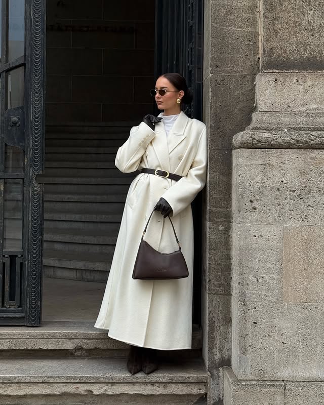 Instagram post by @svenjagzer for Status Anxiety. Caption reads: White winter layers & the perfect brown....