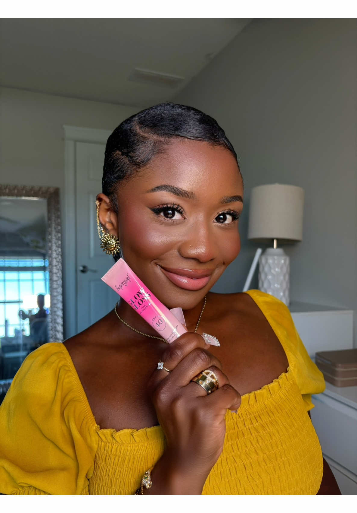 TikTok post by @abakasante for Supergoop. Caption reads: My lips + @Supergoop = Summer Essentials....