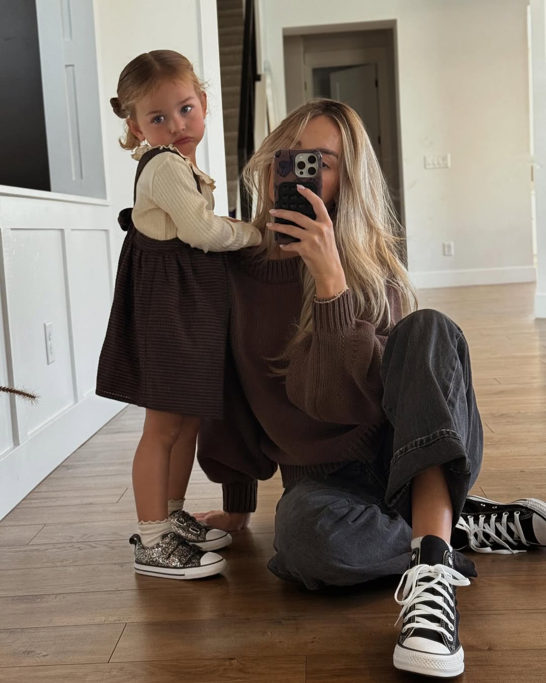 Instagram post by @camille_munday for DSW. Caption reads: Family photo shoot featuring our @converse from....