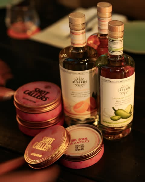 Instagram post by @daniellerobay for 21Seeds Infused Tequila. Caption reads: SHOT CALLERS: 52 Cards for Girls Who Call The....