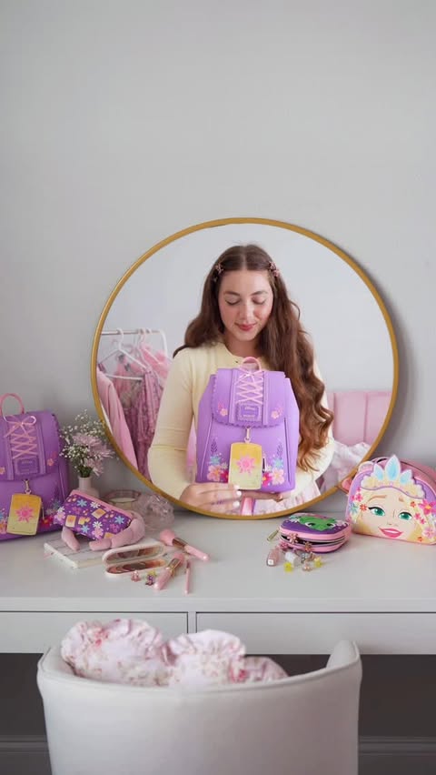 Instagram post by @dreamwithvalen for loungefly. Caption reads: [...] Rapunzel inspired outfit featuring my....