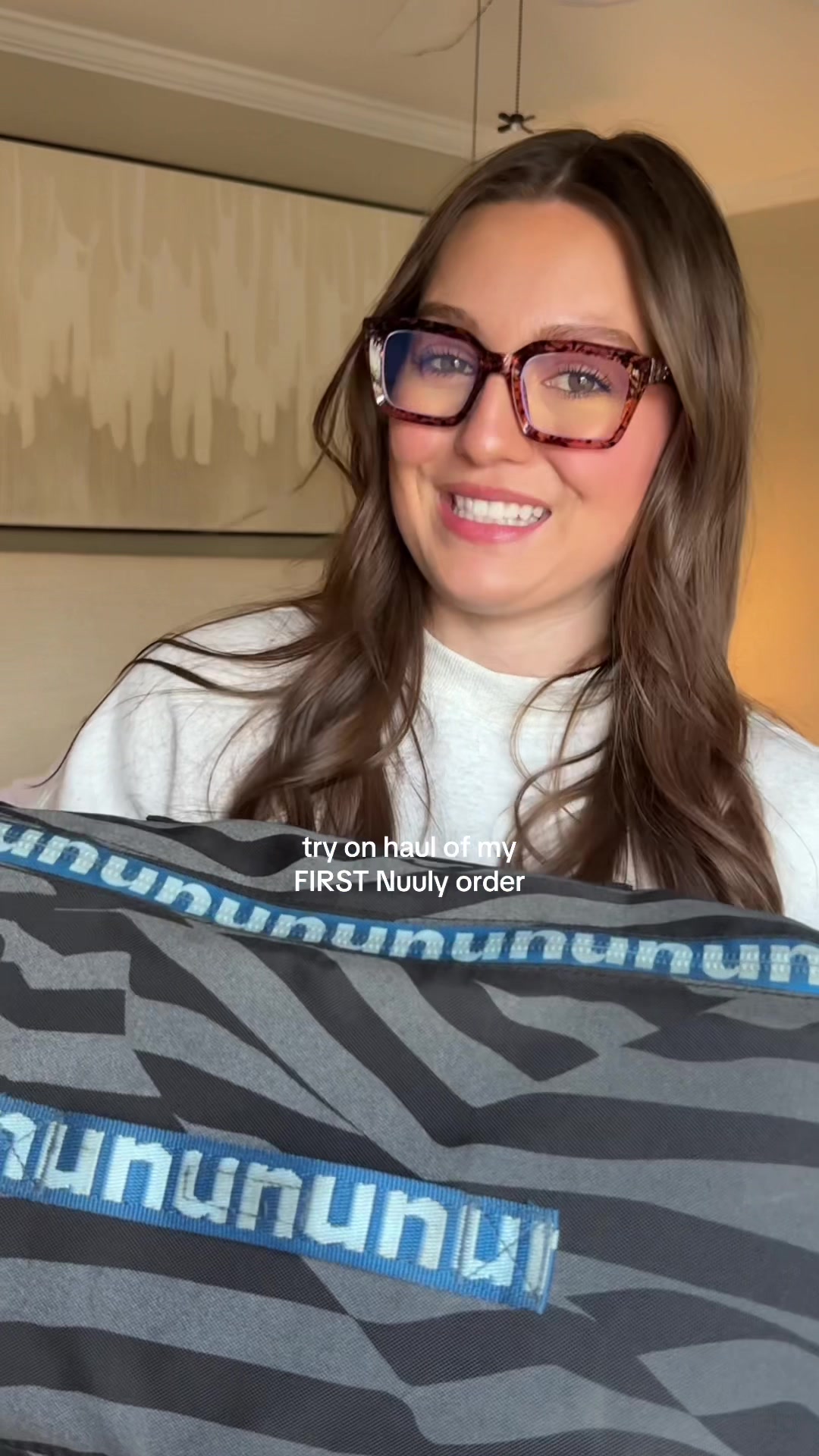 TikTok post by @sarahlynnrain for Nuuly. Caption reads: I may be ruined!!! I am loving my first @nuuly....