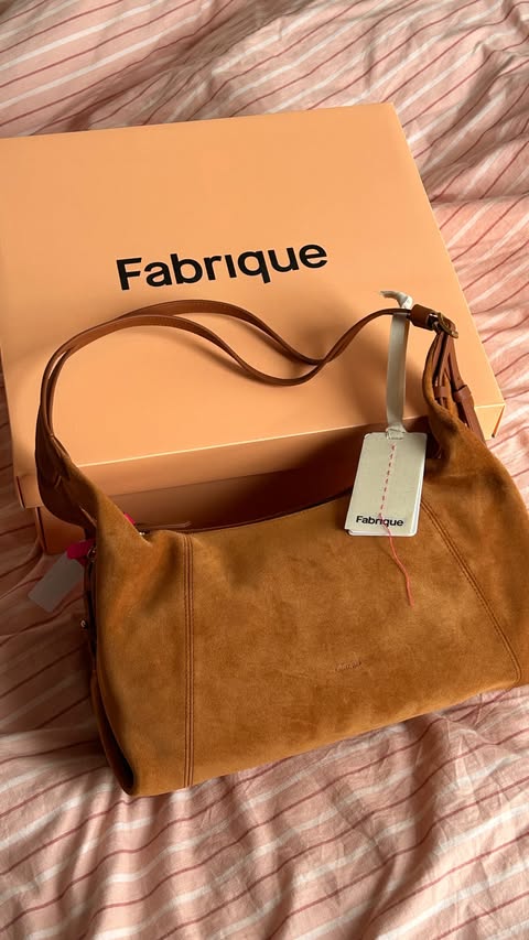 Instagram post by @alexgregoryyyy for Fabrique. Caption reads: @fabrique.official Aura slouchy medium hobo bag....