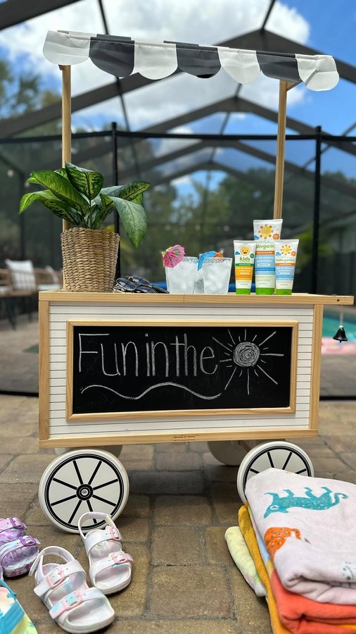 Instagram post by @whimsic_al for babyganics. Caption reads: Get ready with us for a pool day! The girls are in....