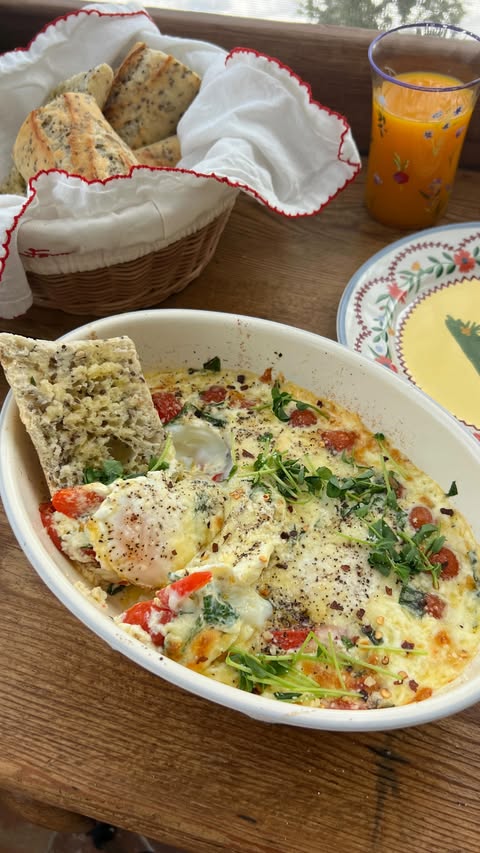 Instagram post by @gatherednutrition for Nellie's Free Range. Caption reads: Creamy Baked Eggs made with @nelliesfreerange....