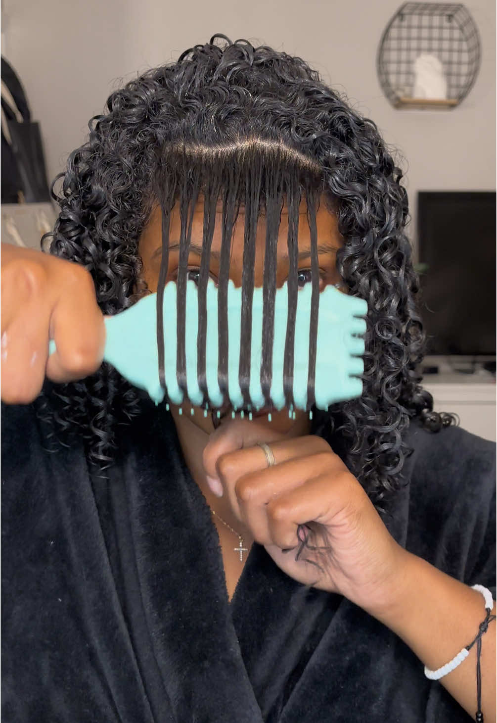 TikTok post by @curlyymacyy for BounceCurl. Caption reads: How I define my curls using the @BounceCurl 😍😍➰....