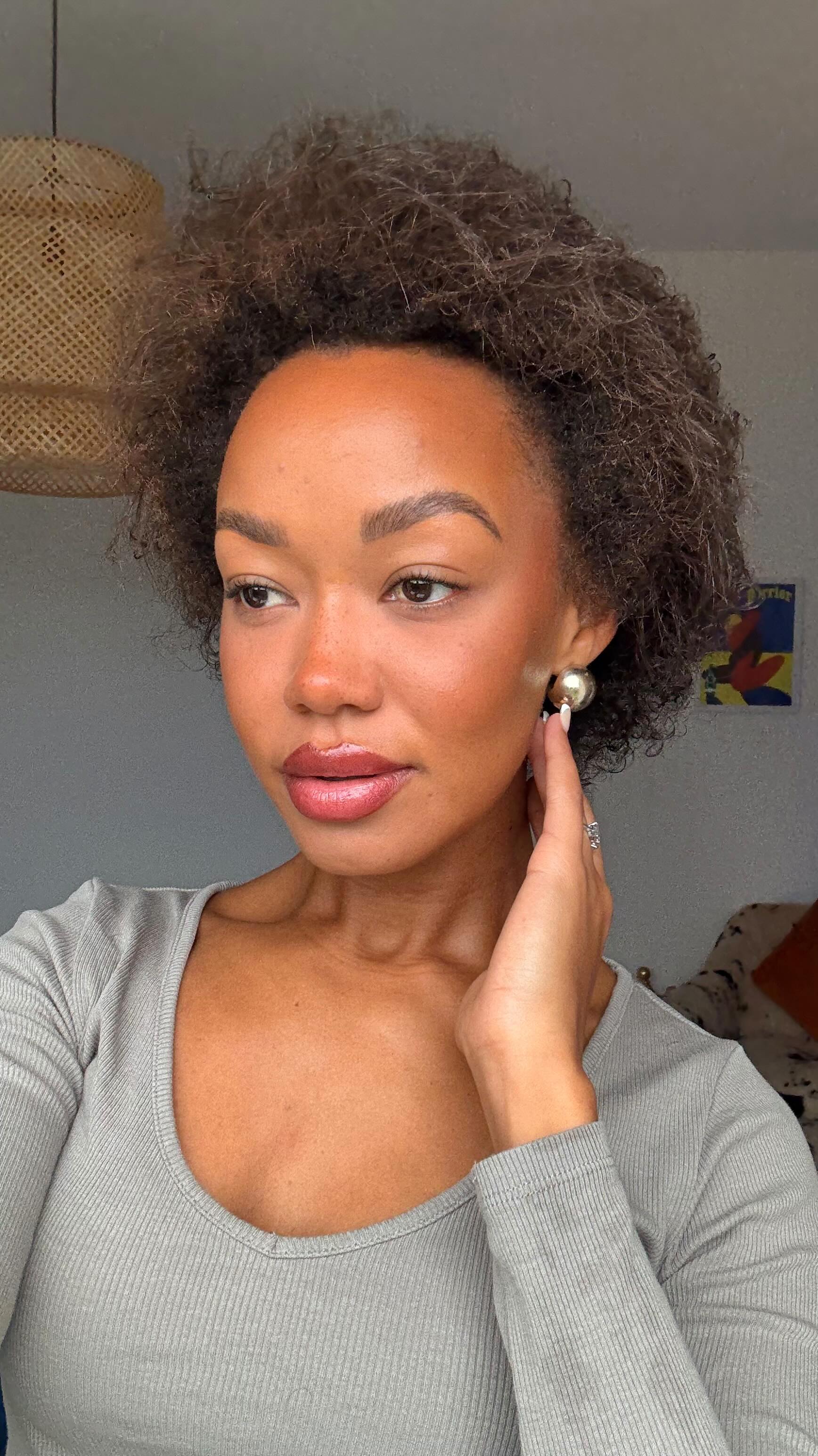 Instagram post by @maggielizsmithx for ARKIVE HEADCARE. Caption reads: My quick go to Afro refresh. @arkiveheadcare....