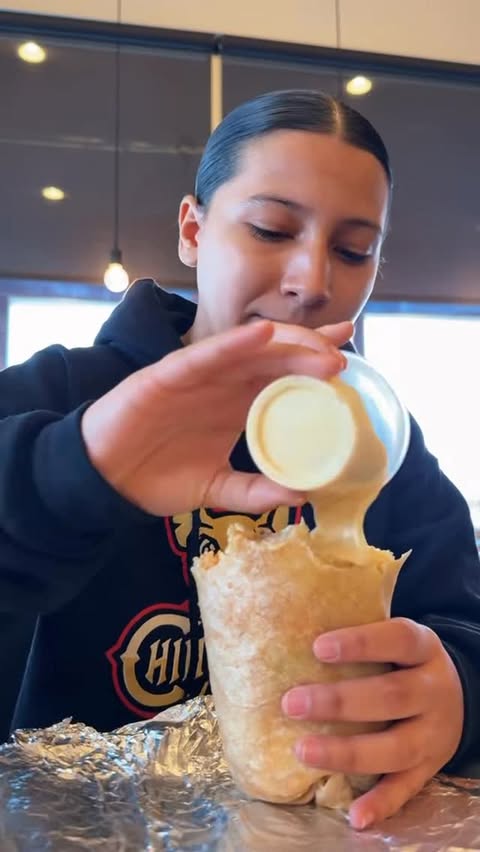 Instagram post by @thepuigfamily for Chipotle. Caption reads: @chipotle Mukbang with Tati😋 #mukbang #eat....