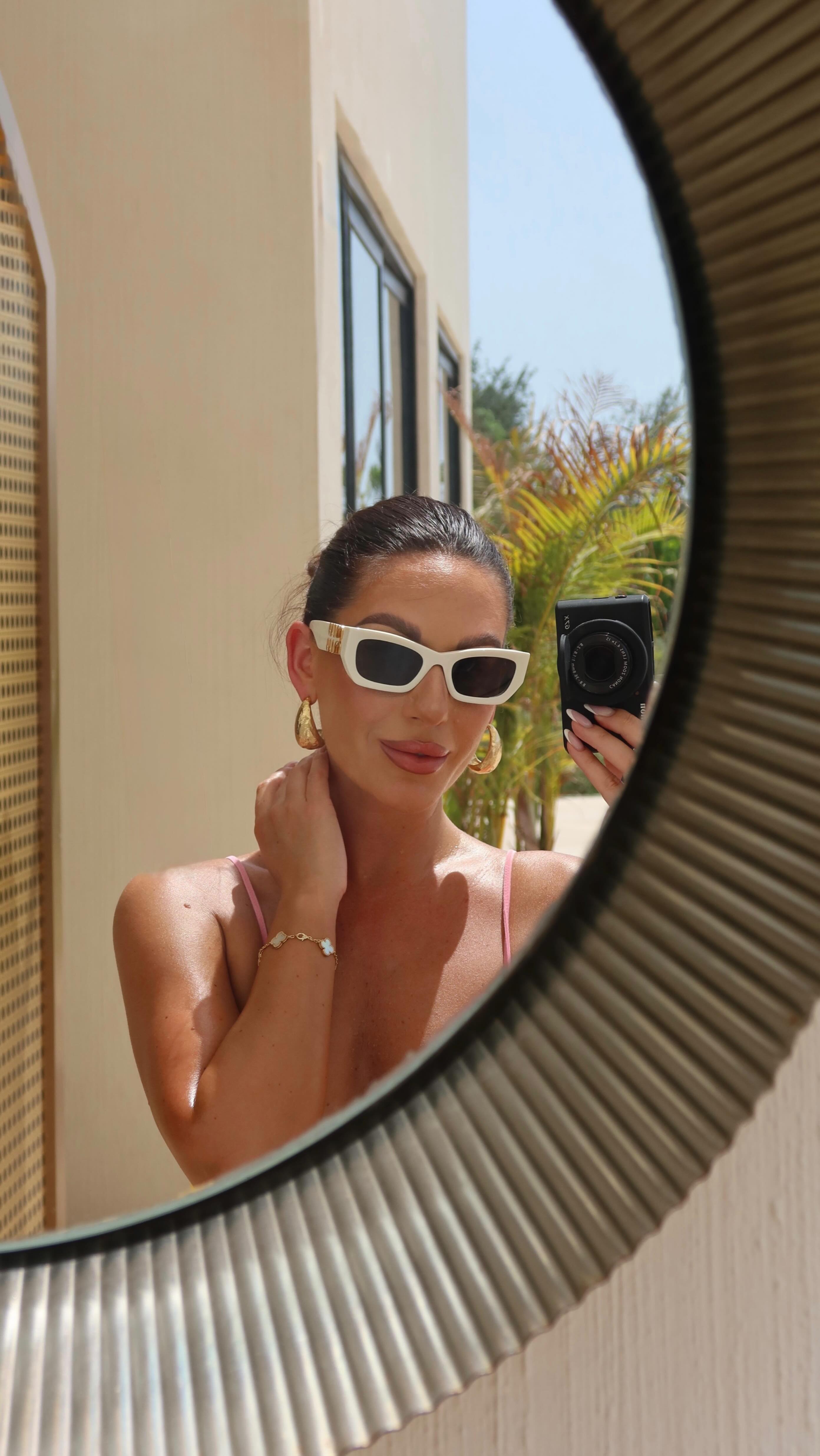 Instagram post by @victorialazarukofficial for The Giving Movement. Caption reads: THIS or THAT 🌪️
•
All outfits @thegivingmovement....