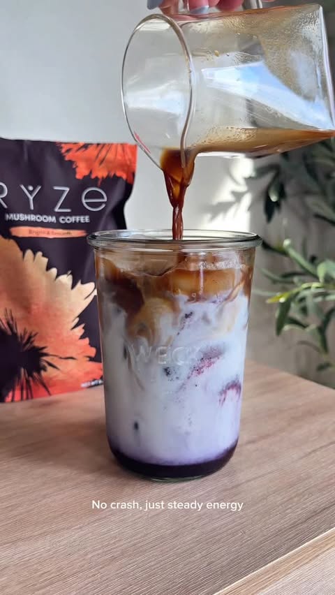Instagram post by @coffeebyhailey for RYZE SUPERFOODS. Caption reads: [...] blueberry vanilla latte made with....