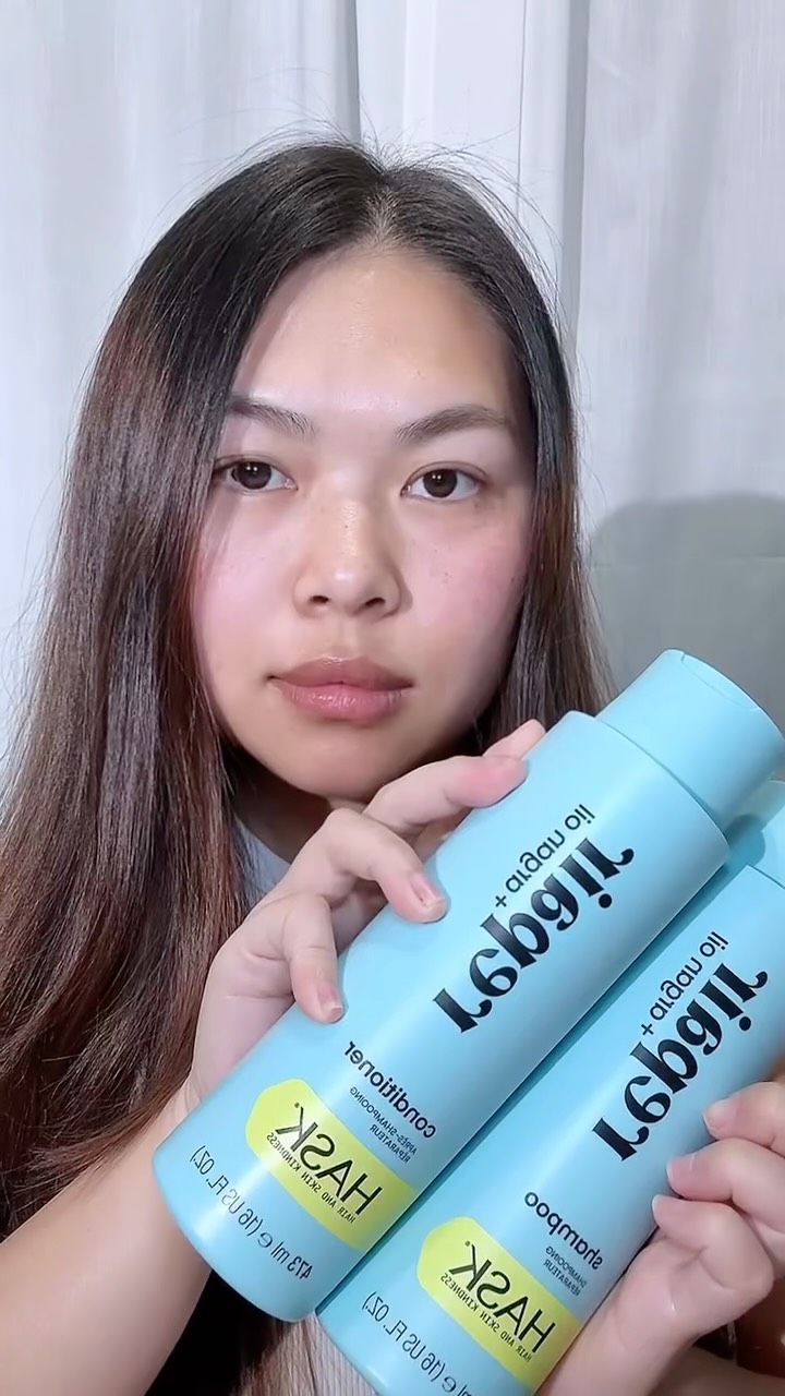 Instagram post by @nisa.rev for HASK. Caption reads: Hask Repair + Argan Oil Shampoo & Conditioner....