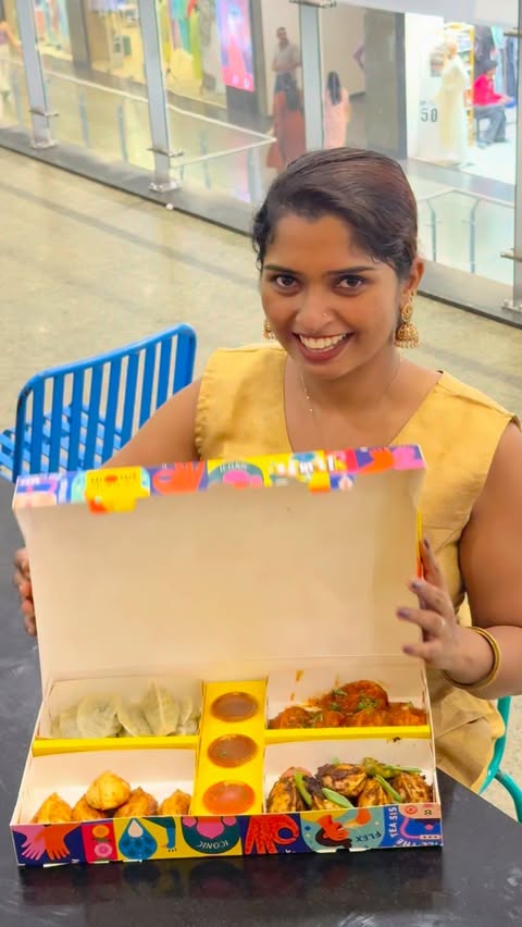 Instagram post by @_vrinda_manikandan for Wow! Momo. Caption reads: [...] WOW! 🌼🥟💛 Get ready to feast on the WOW!....