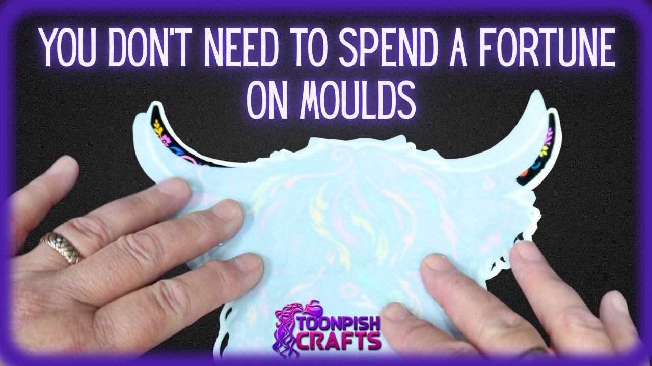 YouTube post by @Toonpish for Envato Elements. Caption reads: No Mold? No Problem! Easy DIY Resin Highland Cow!.