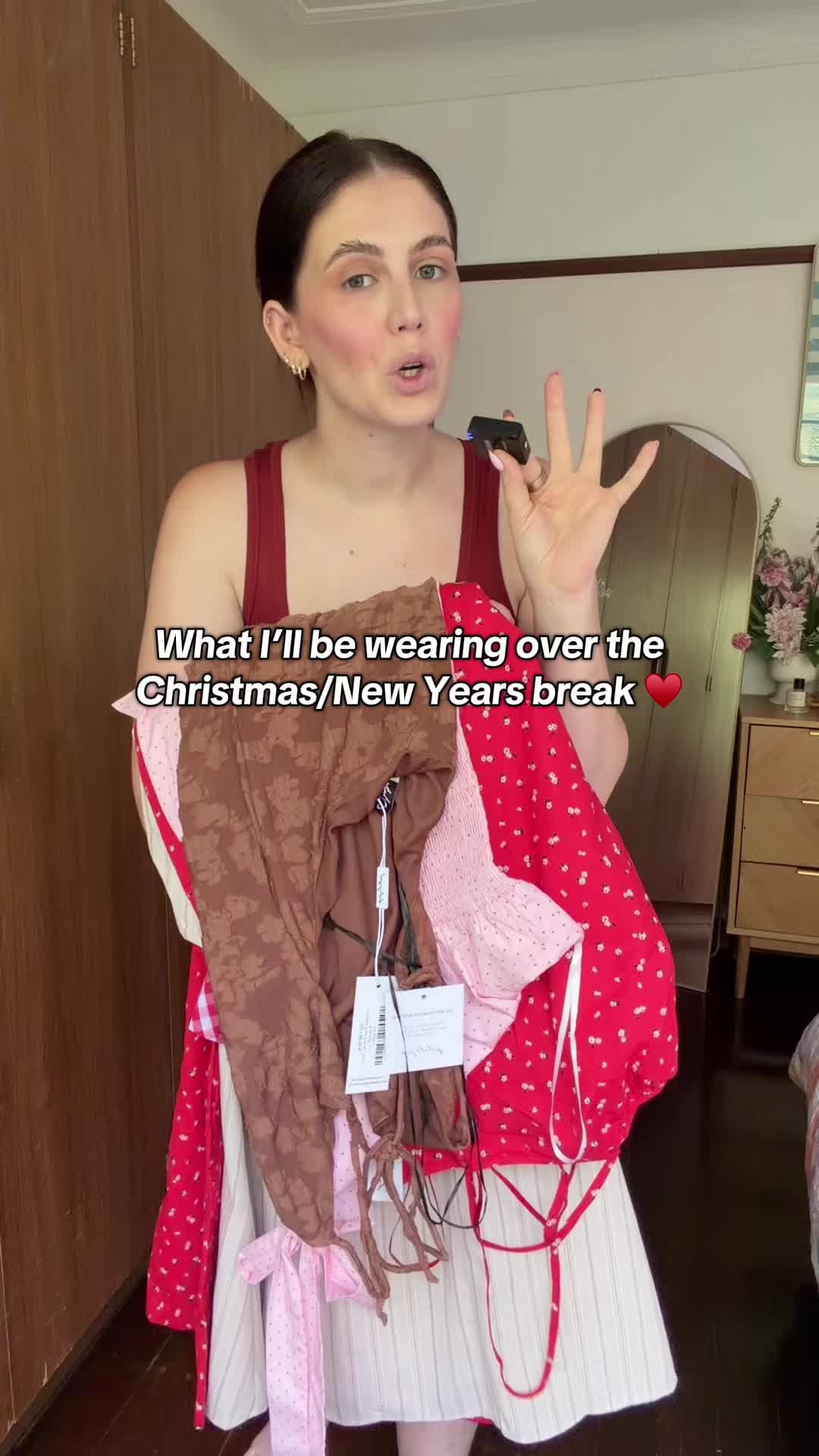 TikTok post by @bellsmessina for Petalandpup. Caption reads: For the record… the red jumpsuit?! Yeah. OBSESSED.....