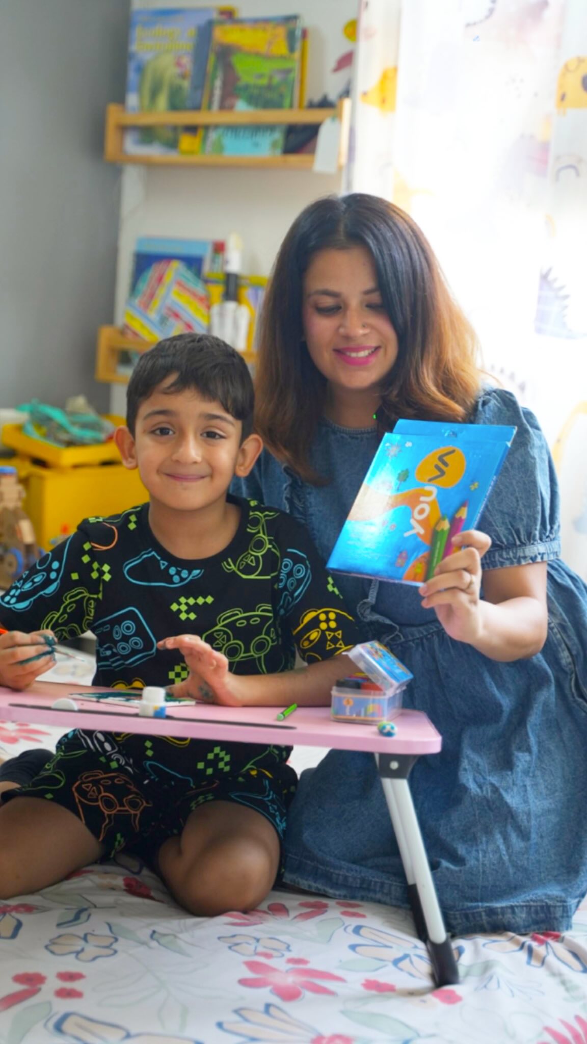 Instagram post by @the_popsicle_stories for Youva stationery. Caption reads: Nothing says holiday fun like a table full of art....