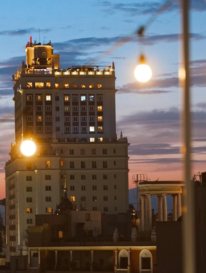 Instagram post by @charlesinraw for Panasonic. Caption reads: Sundays in Madrid. Calor intenso, calles vivas,....