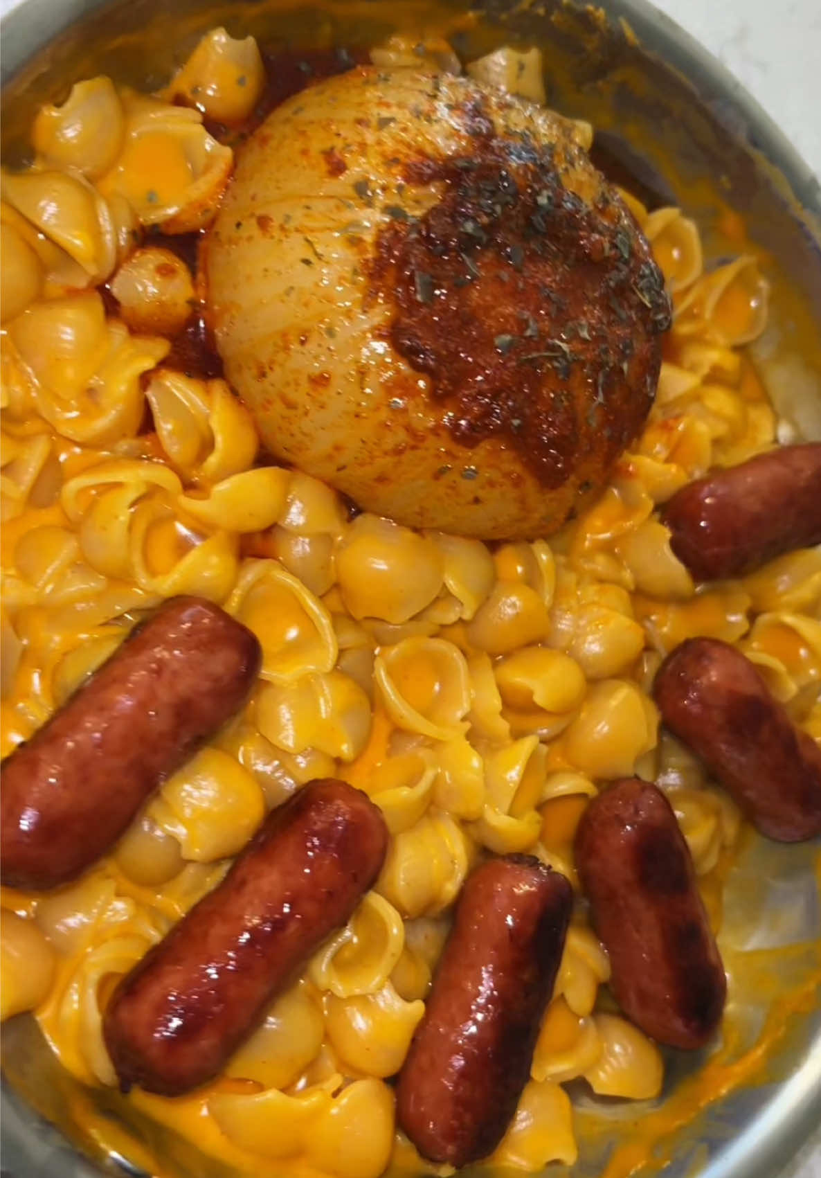 TikTok post by @shelby.eating for Goodles. Caption reads: [...] & cheese w/ onion boil & lit'l smokies....