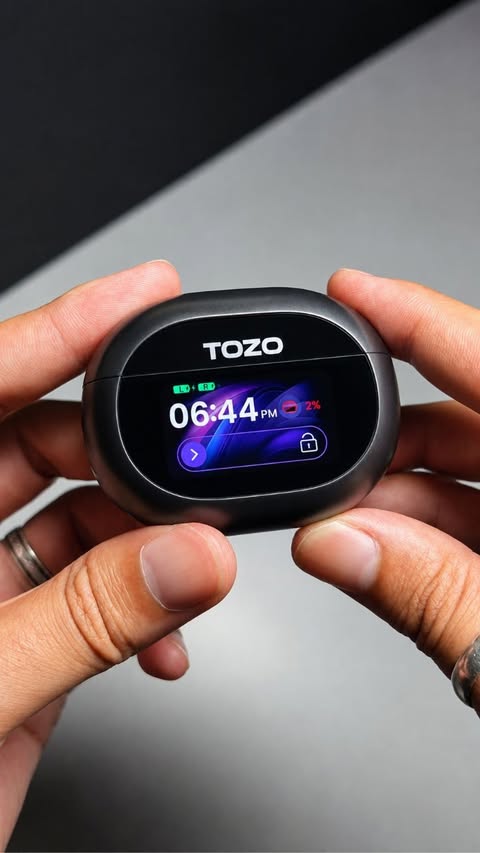 Instagram post by @is.raimo for TOZO. Caption reads: [...] have a TOUCHSCREEN?! 👀🎧 Unboxing the TOZO....