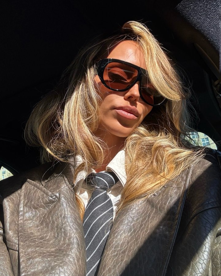 Instagram post by @magdalena.wodecki for OS Sunglasses. Caption reads: Boss of my fashion identity #ootd #tie....