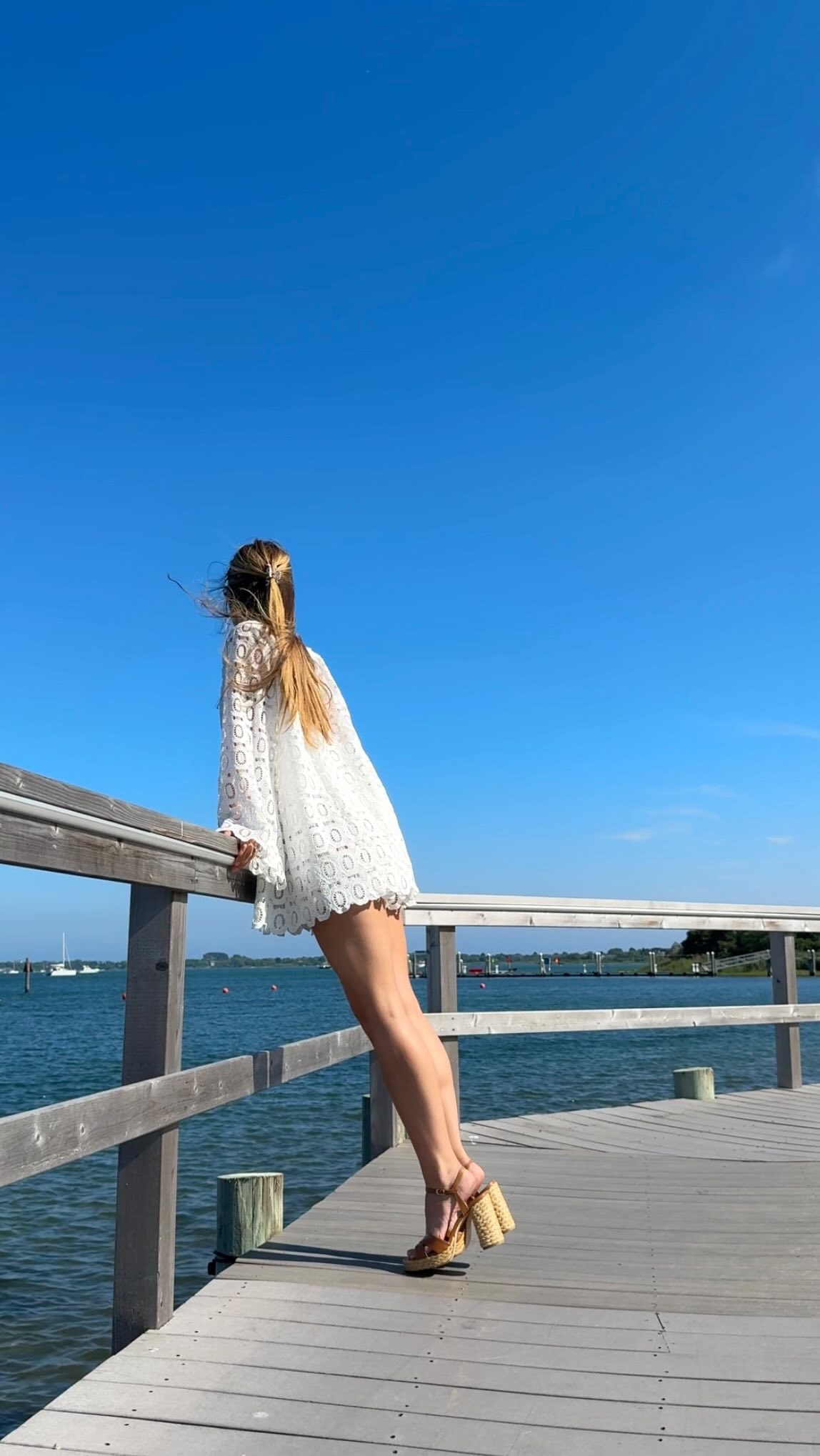 Instagram post by @ageegretta for STUART WEITZMAN. Caption reads: [...] near the ocean for 3 minutes.....